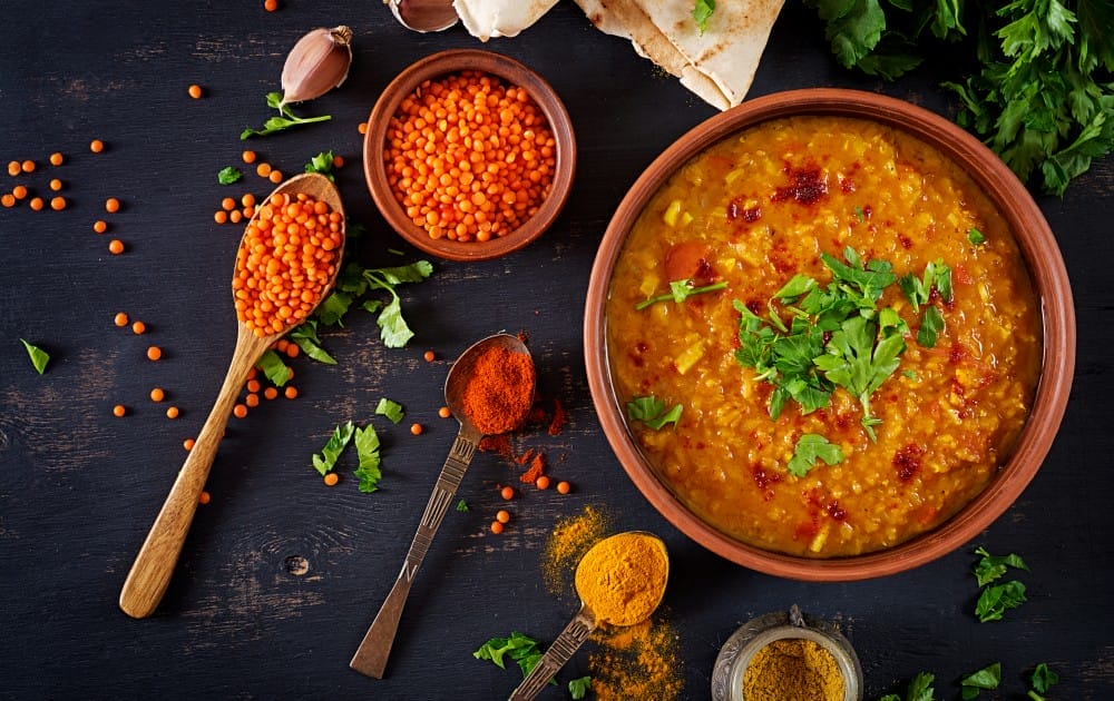 traditional indian soup lentils indian dhal spicy curry bowl spices herbs rustic black wooden table 1