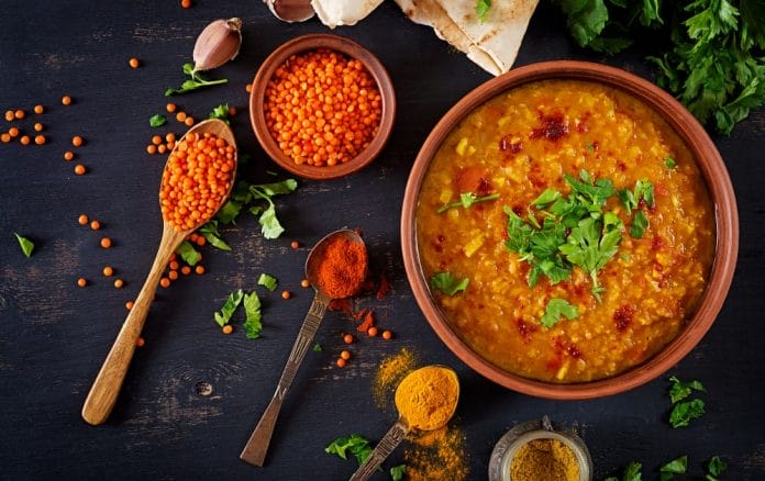 traditional indian soup lentils indian dhal spicy curry bowl spices herbs rustic black wooden table 1