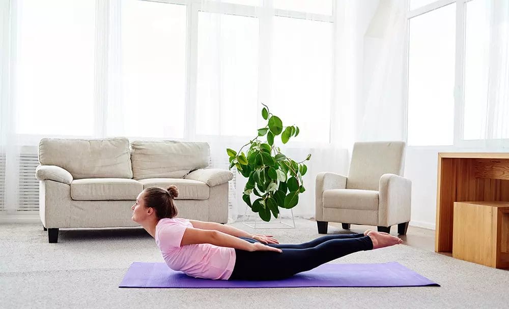 Premium Photo | Woman practicing yoga stretching in salabhasana exercise  double leg kicks pose