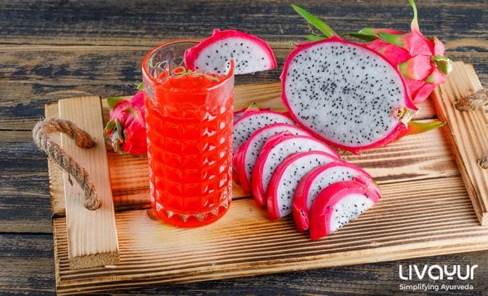 dragon fruit tray with juice high angle view wooden table